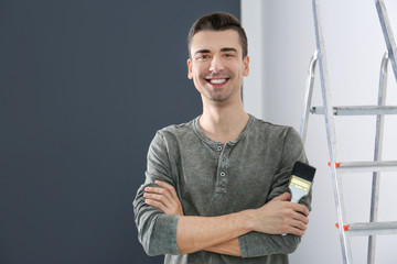 Sticker - Portrait of male decorator with brush indoors