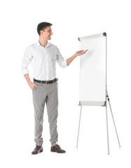 Canvas Print - Business trainer giving presentation on flip chart board against white background