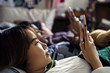 Teenage girls using smartphones on a bed internet in slumber party
