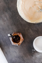 Wall Mural - Chestnut, caramel puree jar and a bowl with cream cheese filling. Dark food photography concept. Vertical, overhead