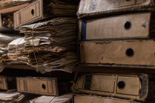 Old Dusty Stack Of Papers, Files, Documents On The Shelves Of Archive Room