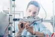 © StockPhotoPro - Young engineer using a 3D printer
