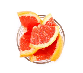 Grapefruit slices in glass bowl isolated on white background, top view