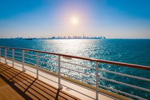 Railing Of Cruise Ship With Dubai Skyline In The Background.