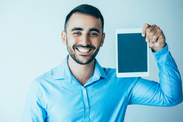 Wall Mural - Happy Handsome Business Man Showing Tablet