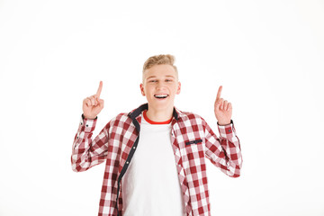 Poster - Portrait of a happy schoolboy pointing fingers up