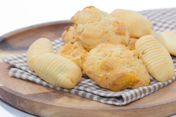 pineapple cookies and Oatmeal cookies on wooden plate