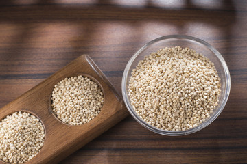 Wall Mural - quinoa beans in bowl on rustic wooden background