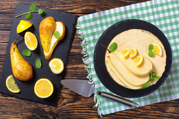 Wall Mural - pear sponge cake on black plate