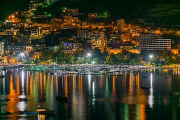 Sticker - A picturesque panorama of the night city from the top of the mountain.