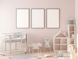 Three poster frame mockup in child room with oval crib 3d rendering