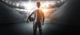 Fototapeta Sport - The football player in the stadium