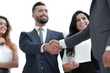 © ASDF - handshake business partners at a meeting