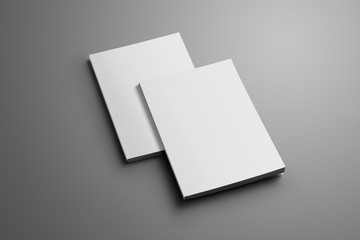 Poster - Two blank closed A4, (A5) brochures with soft shadows isolated on gray background.