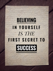 Motivational and inspirational quotes quotes - Believing in yourself is the first secret to success. With vintage styled background.