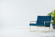 © Photographee.eu - Blue chair with golden frame