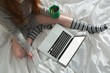 © Wavebreak Media - Woman using laptop in bedroom