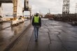 © Wavebreak Media - Dock worker walking in the shipyard
