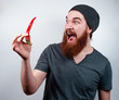© Vulp - Hipster man scared of chili pepper