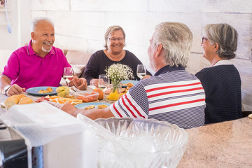 group of aged people having lunch