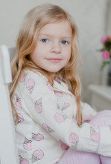 portrait of a little blonde girl with loose hair