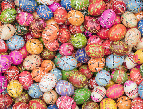 Fotografie, Obraz Basket full of traditional Polish, multi-colored, handpainted wooden Easter eggs