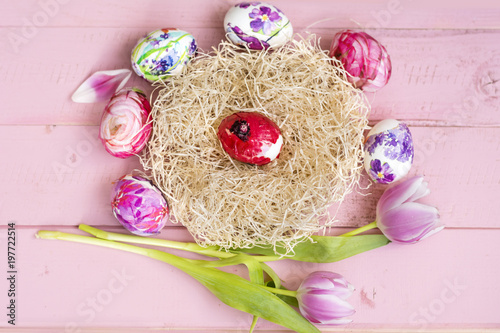 Pink Easter Eggs And Tulips Flowers On A Pink Wooden Background