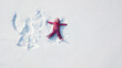 © 4Max - Child girl playing and making a snow angel in the snow. Top flat overhead view