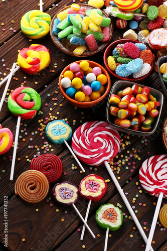 Plakat candies with jelly and sugar. colorful array of different childs sweets and treats.