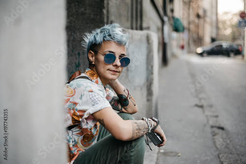 Modern Young Woman With Blue Short Hair And Sunglasses Street