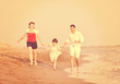 © .shock - happy young family have fun on beach