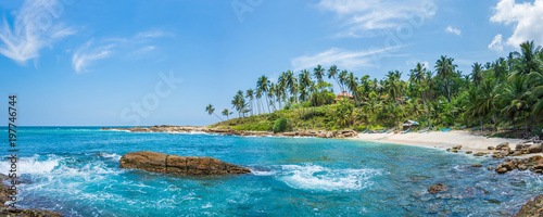 Fotografía Panoramic view of a small lagoon with traditional wooden fishing boats on the beach in Sri Lanka