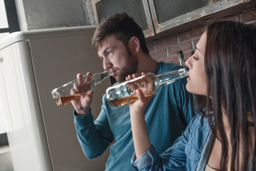 Young family alcoholism social problems concept drinking together