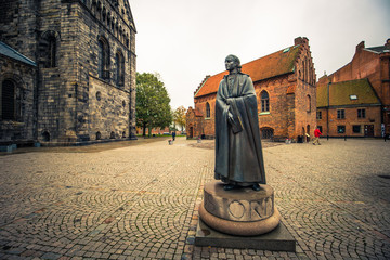 Wall Mural - Lund - October 21, 2017: Statue near the gothic cathedral of Lund, Sweden