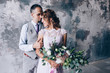 © dimadasha - Photo session of the newlyweds in the studio.