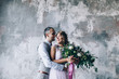 © dimadasha - Photo session of the newlyweds in the studio.