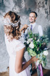 © dimadasha - Photo session of the newlyweds in the studio.