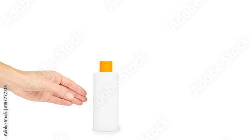 Plastic White Shampoo Bottle With Orange Cap In Hand Isolated On