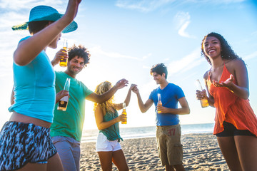 Wall Mural - Friends partying on the beach