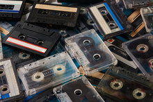 Set Of Old Retro Audio Cassettes Tape On Blue Background, Close-up Top View. 