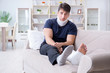 © Elnur - Man injured in car crash recovering at home from whiplash injury