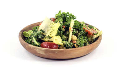 Wall Mural - Raw vegan salad on a wooden plate