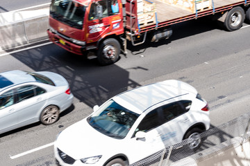 Wall Mural - Cars in motion on the road, high angle view. Cars are moving on the highway, shooting from a high angle, Sydney, Australia.