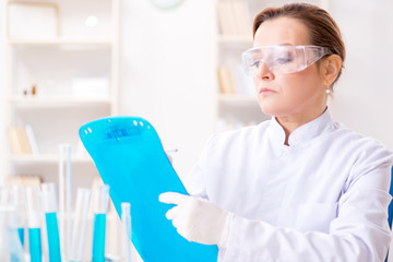 Woman chemist working in hospital clinic lab