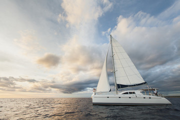 Beautiful bride and groom on a yacht in the ocean