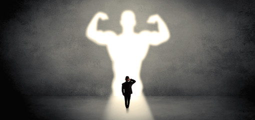 Wall Mural - Businessman standing and dreaming about a strong superhero