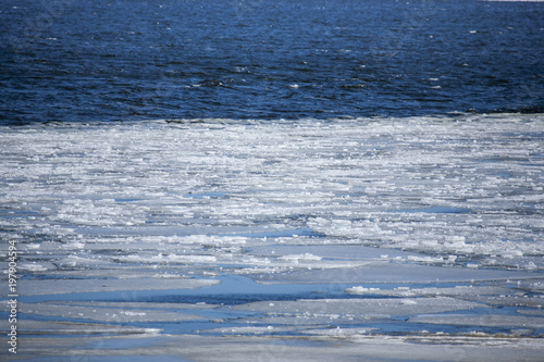 Fotografie, Obraz ice cold ocean filled with ice in the water on a cold winter day in denmark