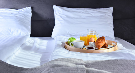 Wall Mural - Breakfast on tray in bed in hotel room