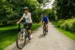 © Jacek Chabraszewski - Healthy lifestyle - people riding bicycles in city park