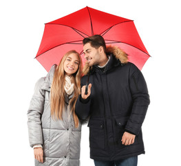 Wall Mural - Young romantic couple with bright umbrella on white background